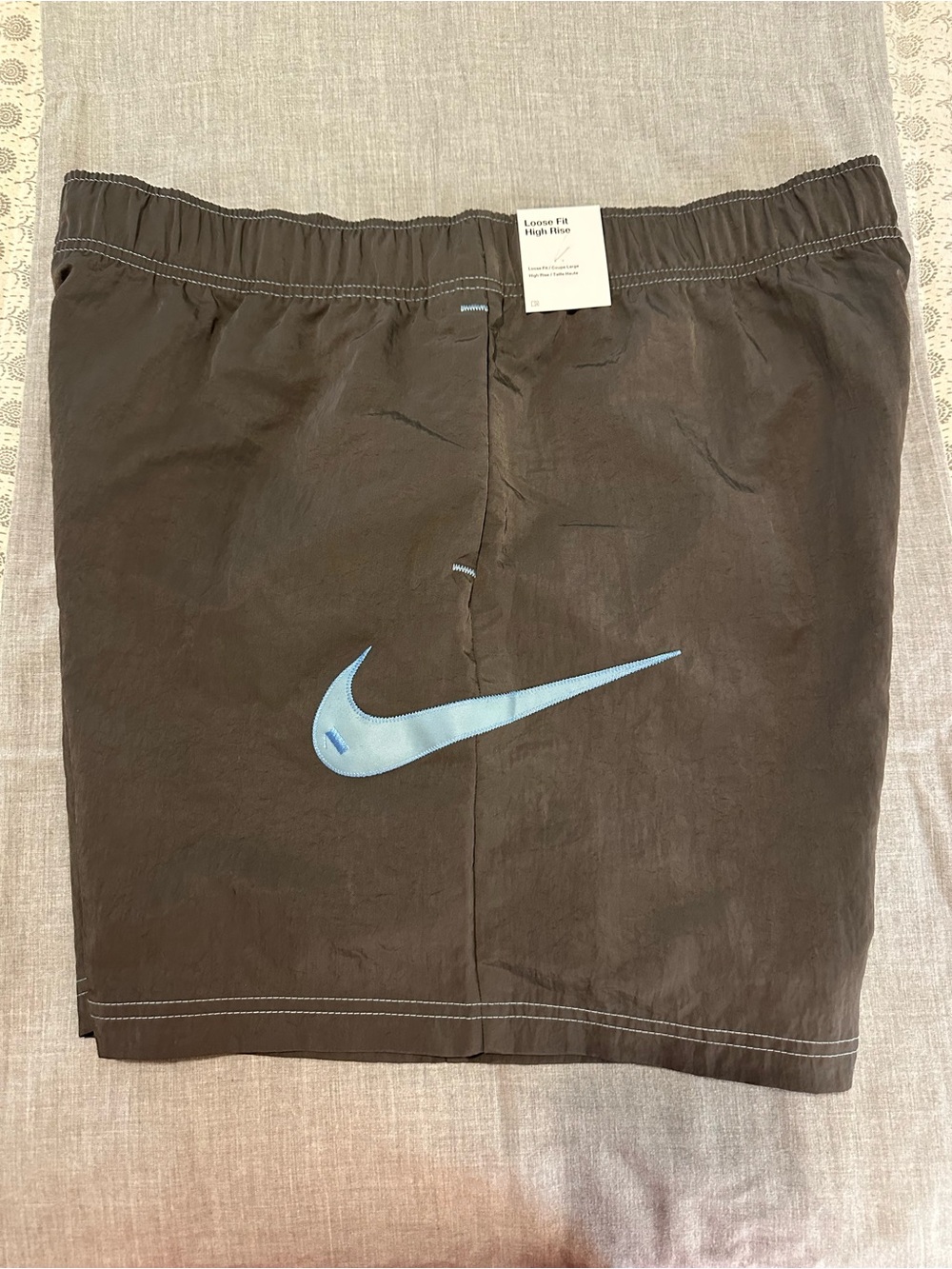Nike Loose fit high rise Shorts with Light Blue Swoosh